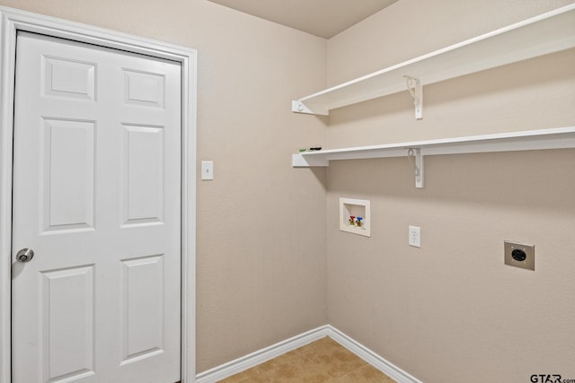 washroom with electric dryer hookup, hookup for a washing machine, and light tile patterned flooring