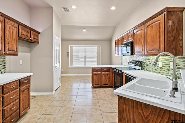 kitchen featuring vaulted ceiling, electric stove, decorative backsplash, light tile patterned floors, and sink