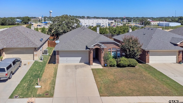 view of front facade with a garage and a front lawn