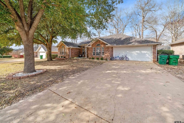 ranch-style house featuring brick siding, an attached garage, and concrete driveway