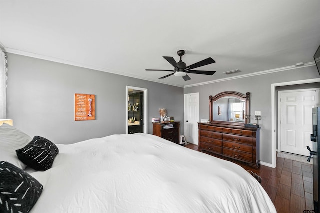 bedroom featuring crown molding, ceiling fan, visible vents, and dark wood finished floors