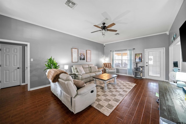 living area featuring ceiling fan, baseboards, wood finished floors, visible vents, and ornamental molding