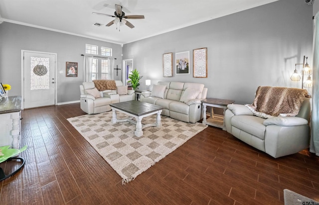 living room featuring crown molding, dark wood finished floors, a ceiling fan, baseboards, and visible vents