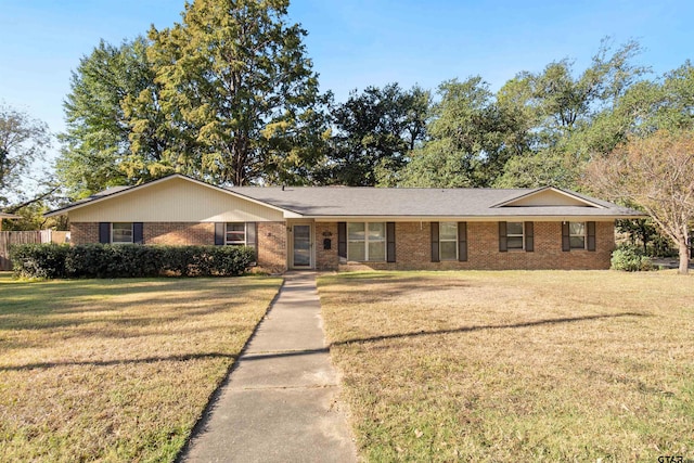 ranch-style house featuring a front lawn