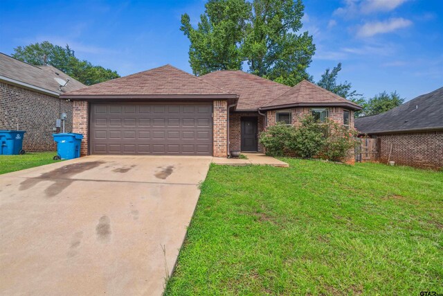 414 Tara Ln, Troup, TX 75789 - ranch-style house with an attached garage, brick siding, a front yard, and concrete driveway