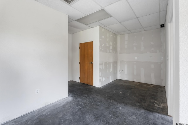 spare room featuring a paneled ceiling