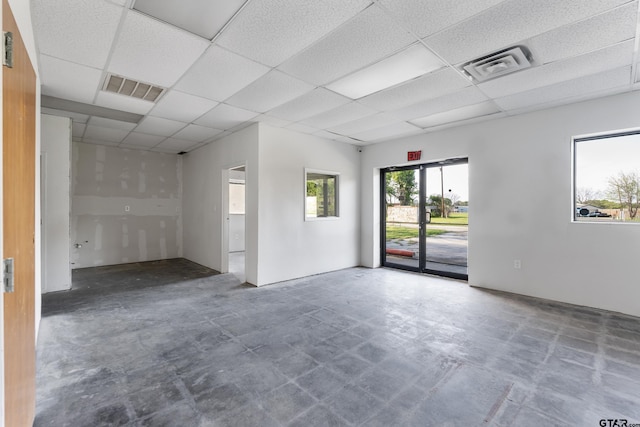 empty room with a paneled ceiling