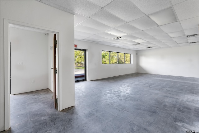 empty room with a drop ceiling