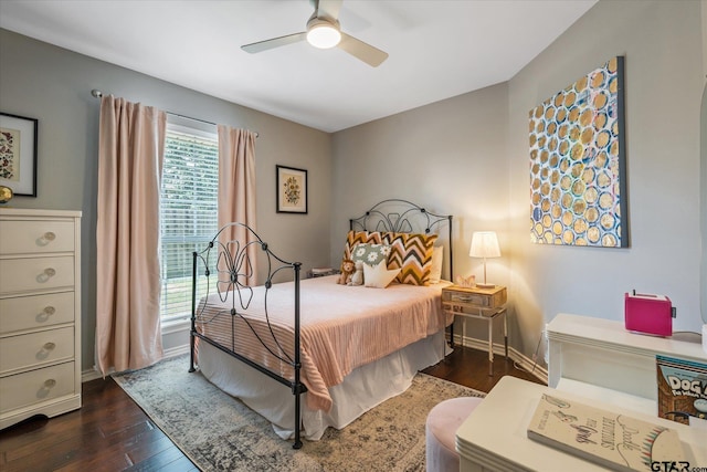 bedroom featuring dark wood-style floors, ceiling fan, and baseboards