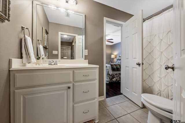 full bath featuring ensuite bathroom, tile patterned flooring, toilet, visible vents, and vanity