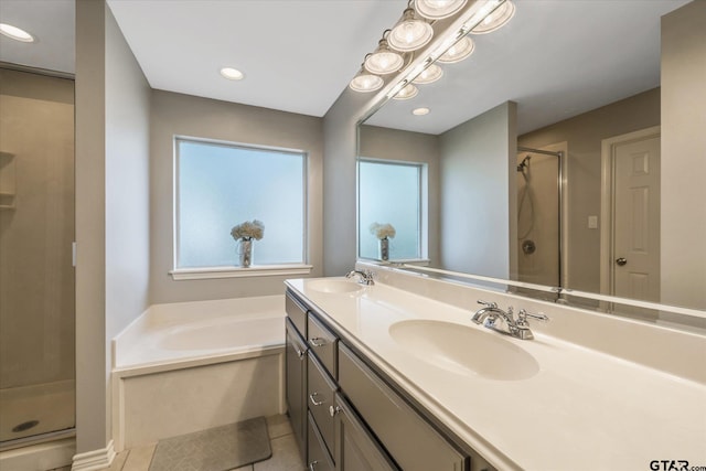 full bath featuring a sink, a shower stall, a bath, and tile patterned floors