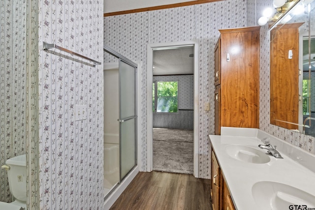 364 San Saba Ln, Mount Vernon, TX 75457 - full bath featuring a sink, a stall shower, wood finished floors, and wallpapered walls
