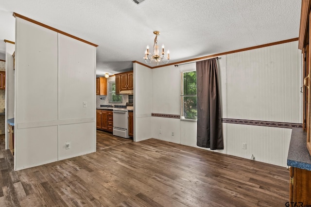 364 San Saba Ln, Mount Vernon, TX 75457 - unfurnished dining area featuring a textured ceiling, a notable chandelier, and dark wood finished floors