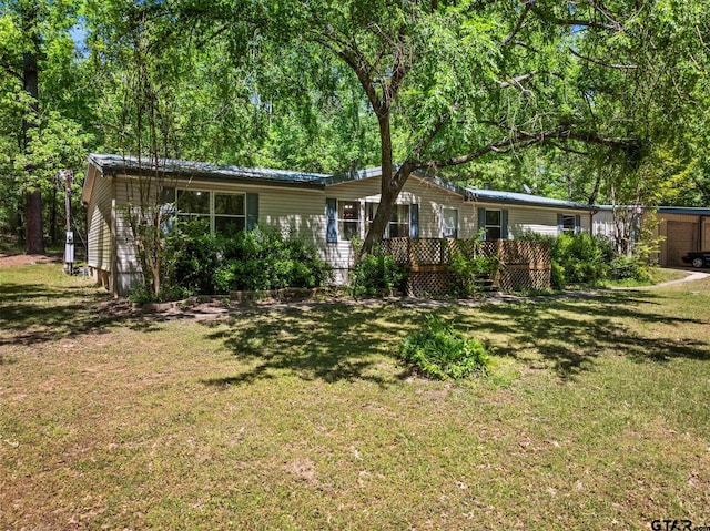 364 San Saba Ln, Mount Vernon, TX 75457 - view of front of home featuring a front lawn and a deck