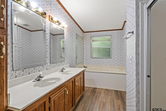 364 San Saba Ln, Mount Vernon, TX 75457 - bathroom with wallpapered walls, a sink, ornamental molding, and wood finished floors