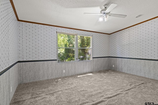 364 San Saba Ln, Mount Vernon, TX 75457 - spare room with wallpapered walls, crown molding, and a ceiling fan