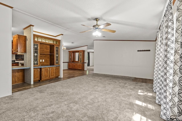 364 San Saba Ln, Mount Vernon, TX 75457 - unfurnished living room with crown molding, a ceiling fan, and carpet floors