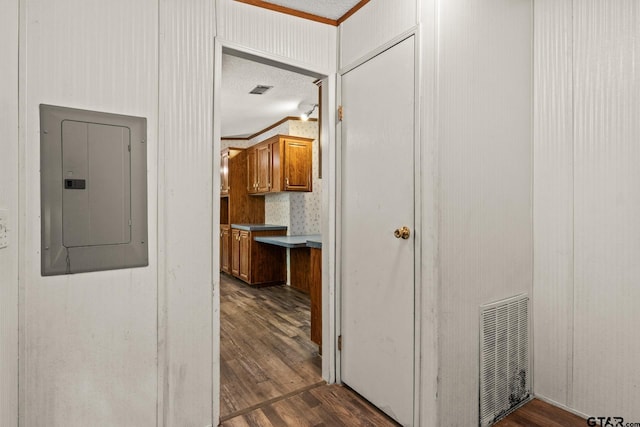 364 San Saba Ln, Mount Vernon, TX 75457 - hall featuring visible vents, electric panel, a textured ceiling, crown molding, and dark wood-style floors