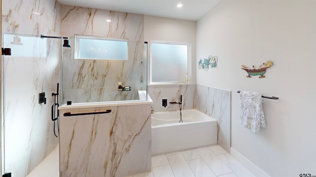 bathroom featuring tile walls, tile patterned flooring, and separate shower and tub