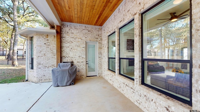 view of patio / terrace featuring area for grilling and ceiling fan