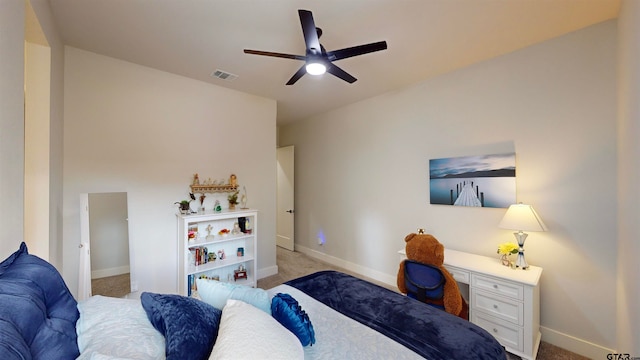 bedroom with light carpet and ceiling fan