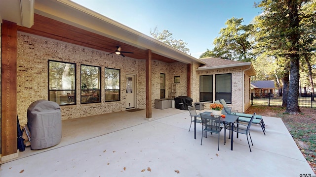 view of patio with a grill and ceiling fan