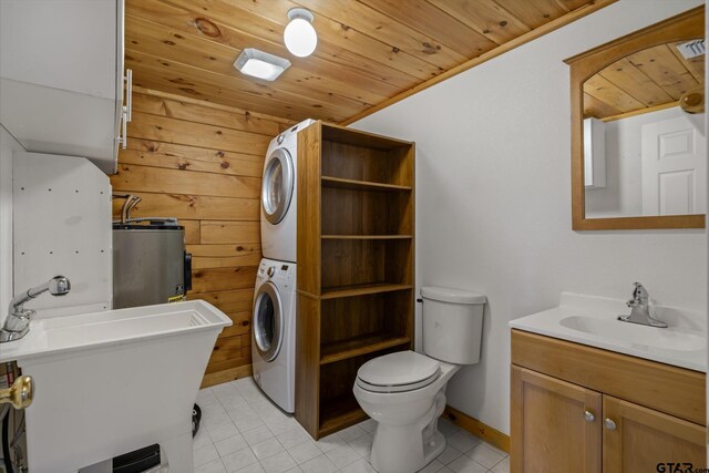 11698 Piper Ln, Frankston, TX 75763 - bathroom featuring stacked washer / dryer, vanity, wood ceiling, tile patterned flooring, and toilet