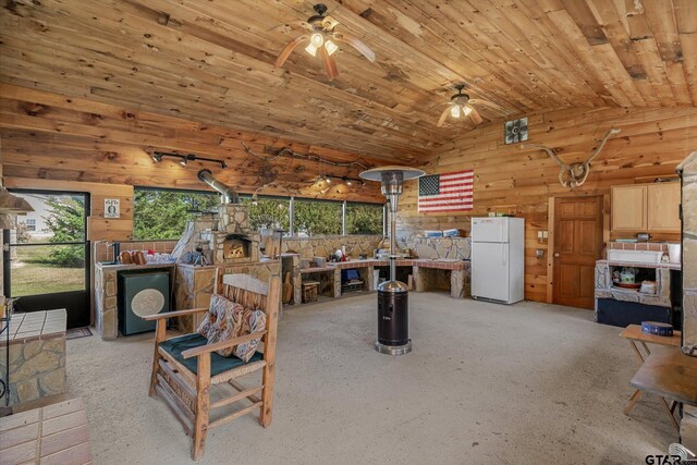 11698 Piper Ln, Frankston, TX 75763 - living area featuring ceiling fan, wood walls, and vaulted ceiling