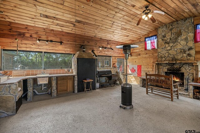11698 Piper Ln, Frankston, TX 75763 - living room featuring a ceiling fan, a stone fireplace, and high vaulted ceiling