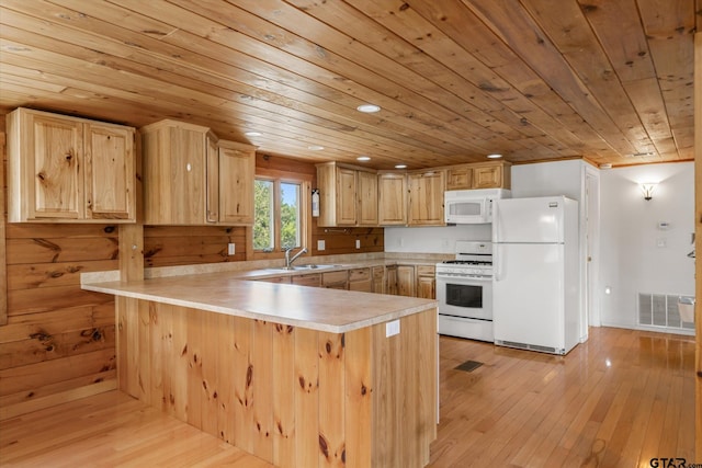 11698 Piper Ln, Frankston, TX 75763 - kitchen with white appliances, wooden ceiling, a peninsula, light countertops, and light wood finished floors