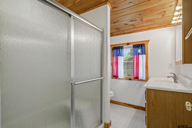 11698 Piper Ln, Frankston, TX 75763 - full bathroom with vanity, toilet, tile patterned floors, a stall shower, and baseboards