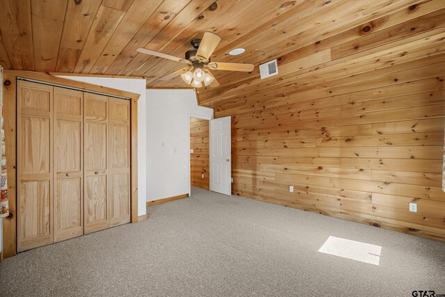 11698 Piper Ln, Frankston, TX 75763 - unfurnished bedroom featuring carpet, wood ceiling, wood walls, a closet, and baseboards