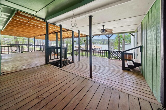 wooden deck featuring a water view