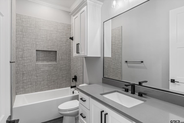 full bathroom with toilet, tiled shower / bath combo, vanity, and crown molding