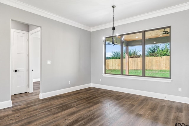 unfurnished dining area with dark hardwood / wood-style floors, crown molding, and an inviting chandelier