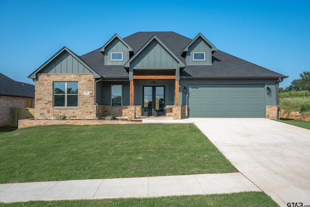 craftsman-style house featuring a garage, a front yard, and french doors