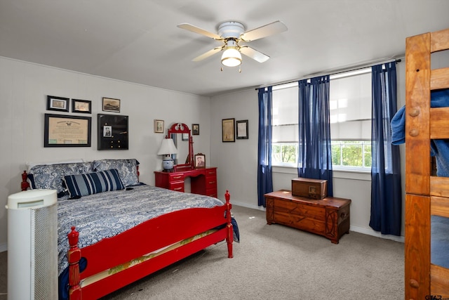 carpeted bedroom featuring ceiling fan and baseboards