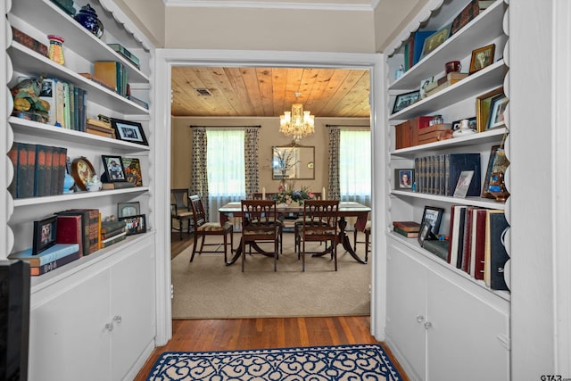 dining space featuring wooden ceiling, plenty of natural light, a notable chandelier, and dark wood finished floors