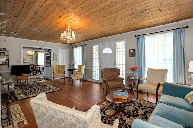 living room featuring visible vents, wooden ceiling, a notable chandelier, and wood finished floors