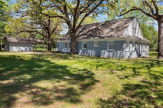 view of yard with a storage shed and an outdoor structure