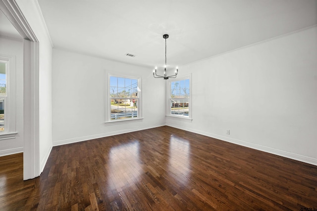 unfurnished dining area featuring a notable chandelier, dark hardwood / wood-style flooring, and crown molding