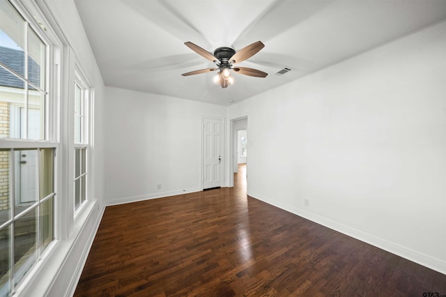 spare room featuring ceiling fan and dark hardwood / wood-style flooring