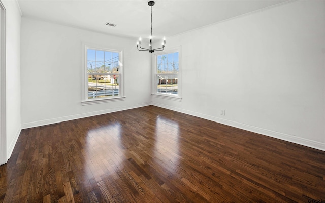 unfurnished dining area featuring dark hardwood / wood-style flooring and an inviting chandelier