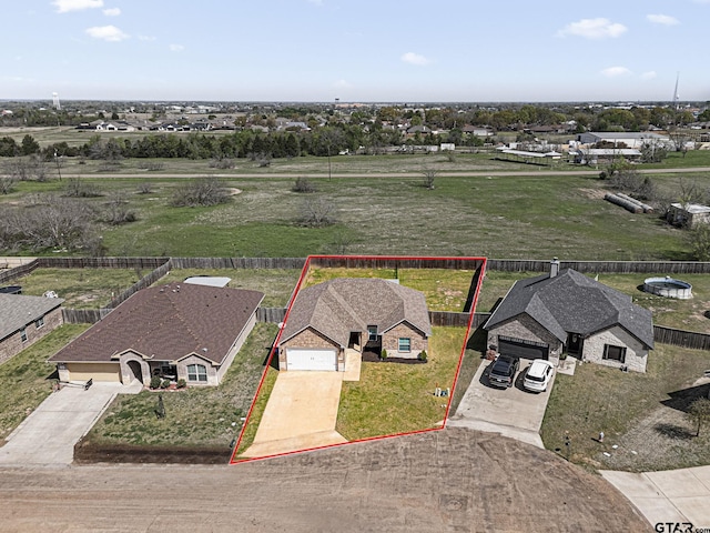 birds eye view of property with a rural view