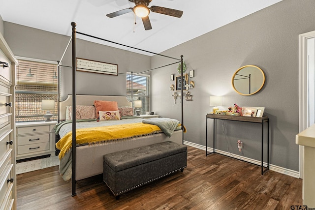 bedroom featuring a ceiling fan, baseboards, and wood finished floors