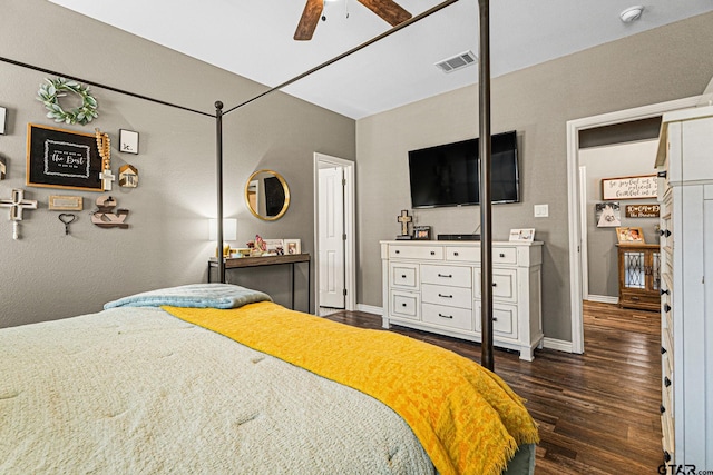 bedroom featuring a ceiling fan, dark wood finished floors, baseboards, and visible vents