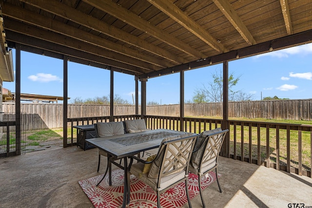 sunroom / solarium with outdoor dining space