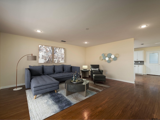 living room featuring dark hardwood / wood-style floors