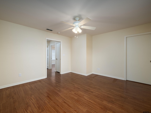 unfurnished room with dark hardwood / wood-style floors and ceiling fan