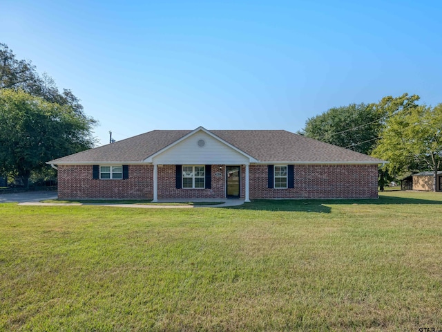 ranch-style home with a front yard